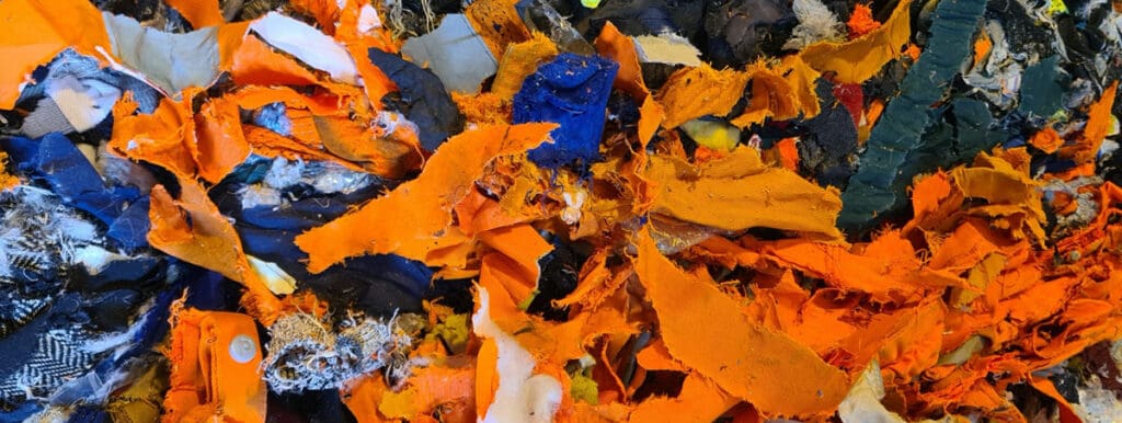 Images shows shredded high vis clothing in a pile at Avena facility 